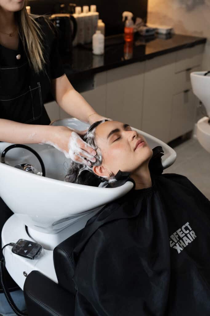 Washing hair at PERFECT X HAIR